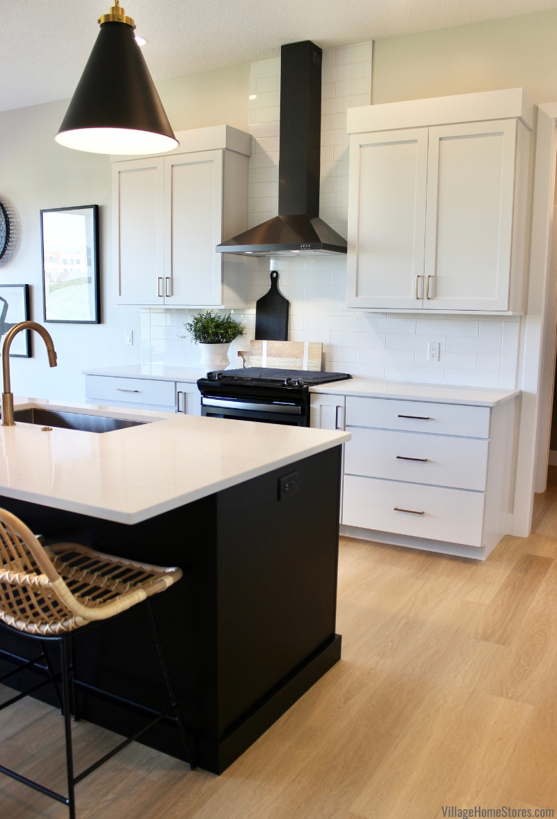Kitchen Island with High Contrast Palette and Rattan Cane Seats