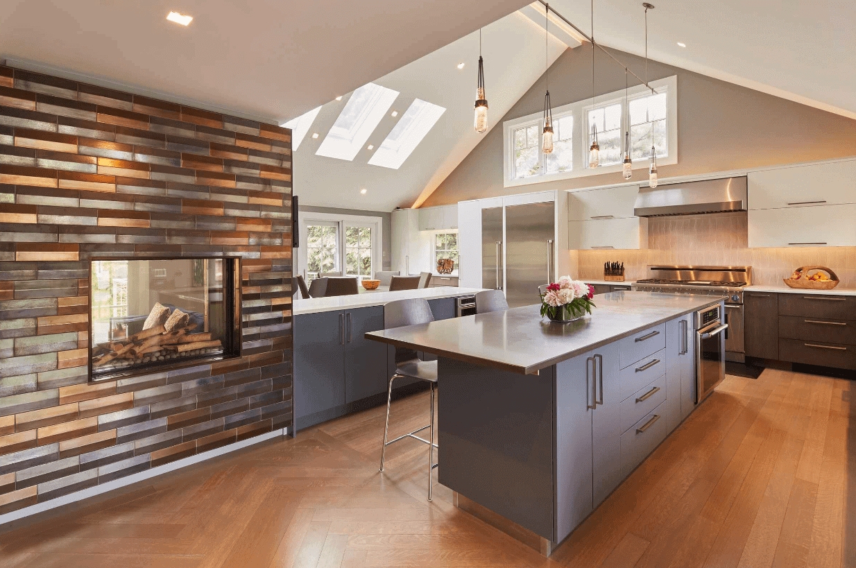 Kitchen Island with Metallic Tile Wall and See Through Fireplace