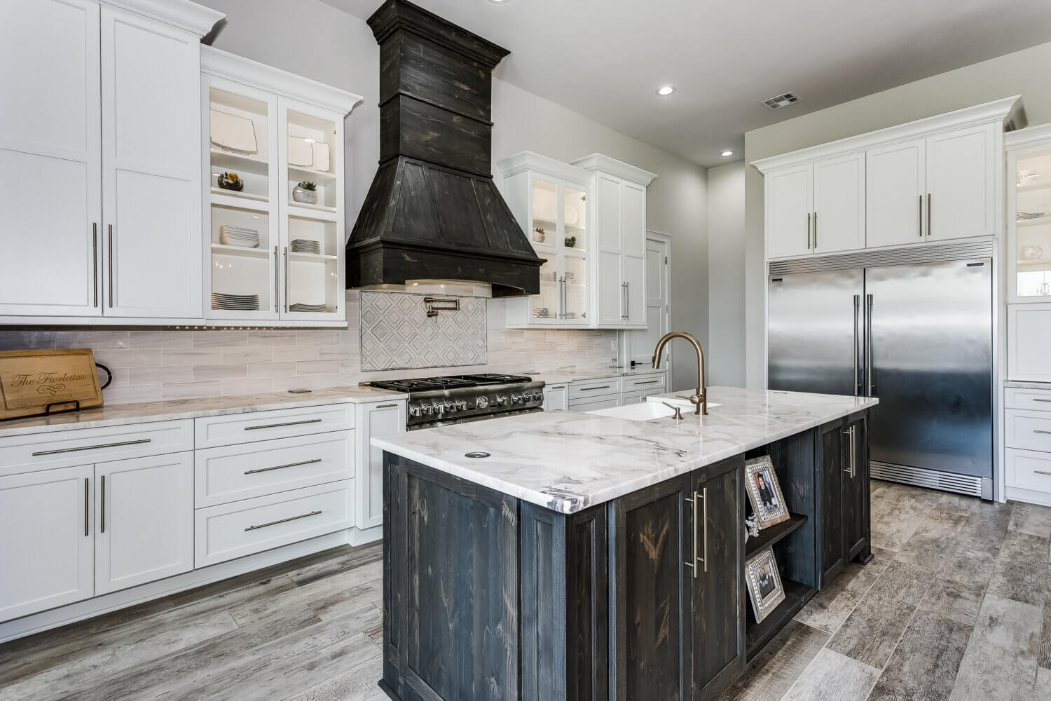 Kitchen Island with Weathered Vent Hood and Brass Pot Filler