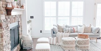 Living Room Set Featuring Textured Boho Floor Poufs And Rug