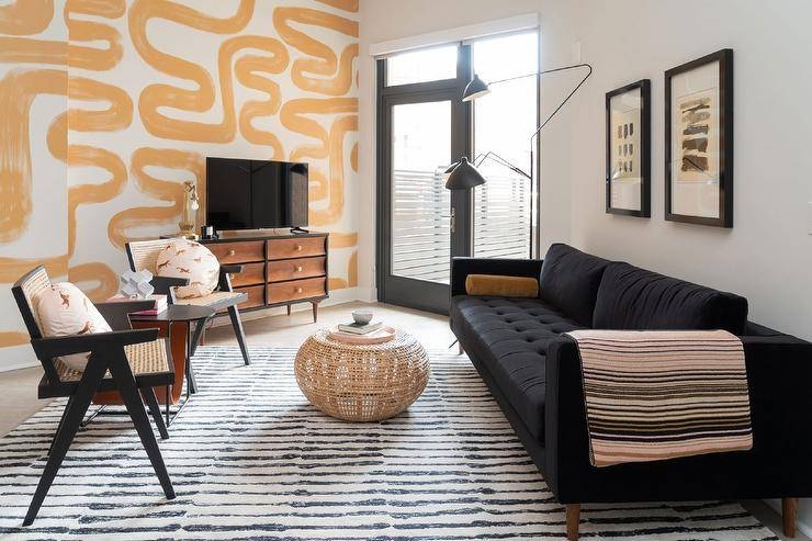 Living Room Set with Wavy Accent Wall and Cane Lounge Chairs Decor