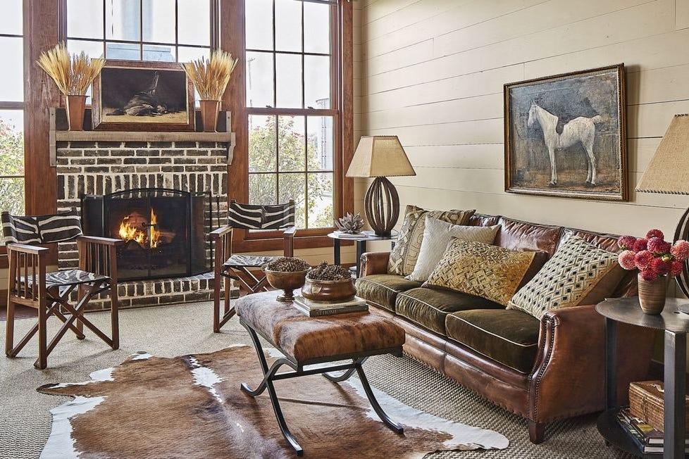 Living Room with Animal Hide Textures and Rustic Fireplace
