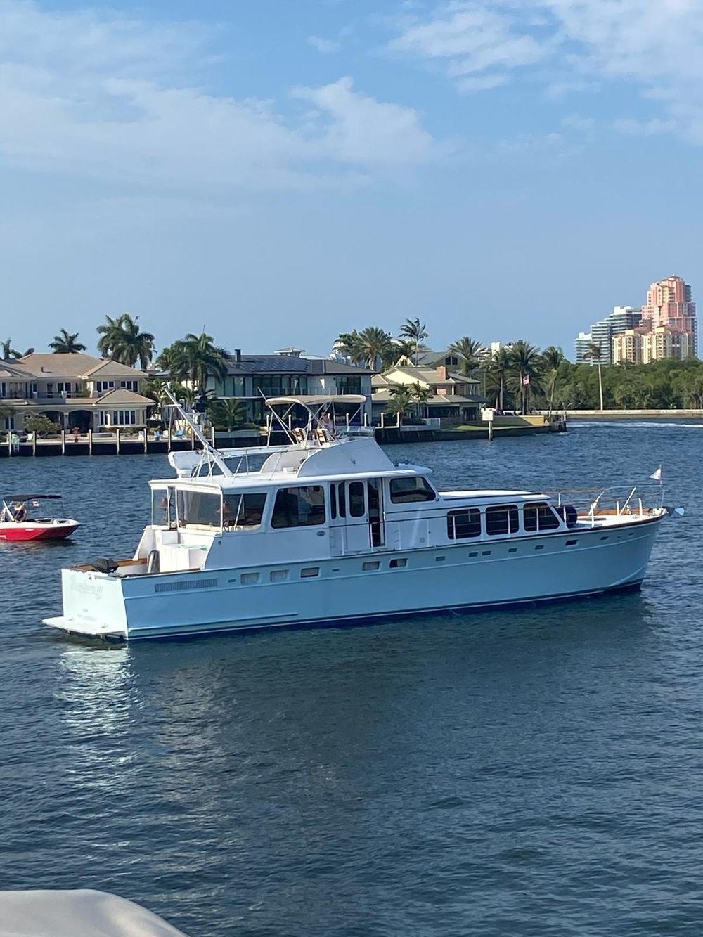 Motor Yacht with 1964 Huckins Silhouette and Light Blue Luxury Boat