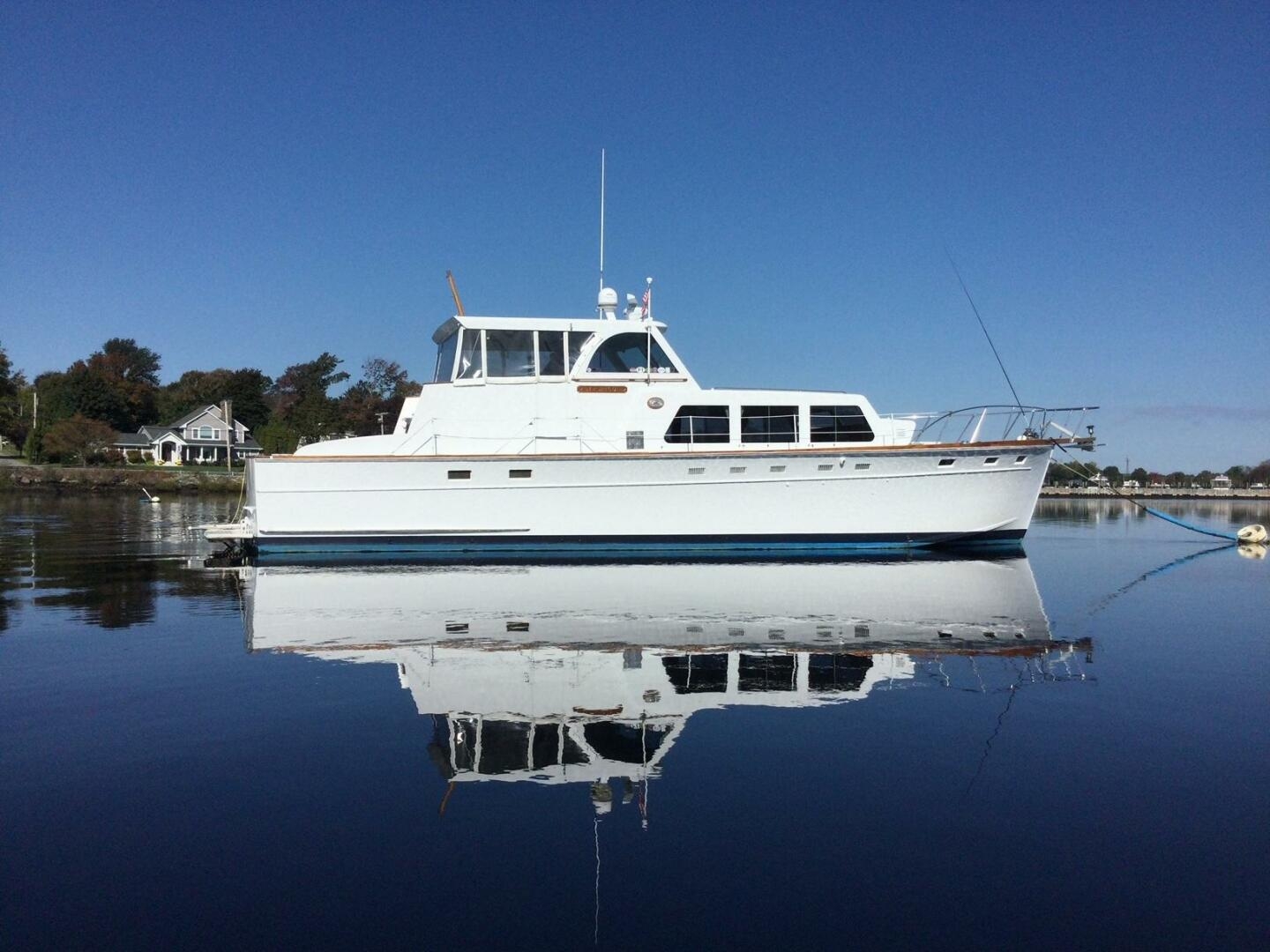 Motor Yacht with Enclosed Pilothouse and Water Reflection Design