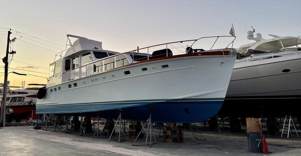 Motor Yacht with Rectangular Portholes and Blue and White Hull