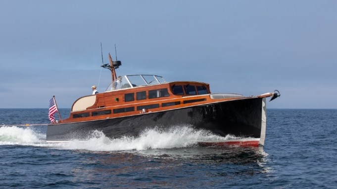 Motor Yacht with Restored Wooden Yacht Aesthetic and Glossy Black Hull