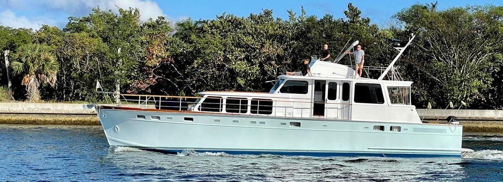 Motor Yacht with Vintage Cruiser Profile and Pale Blue Yacht Hull