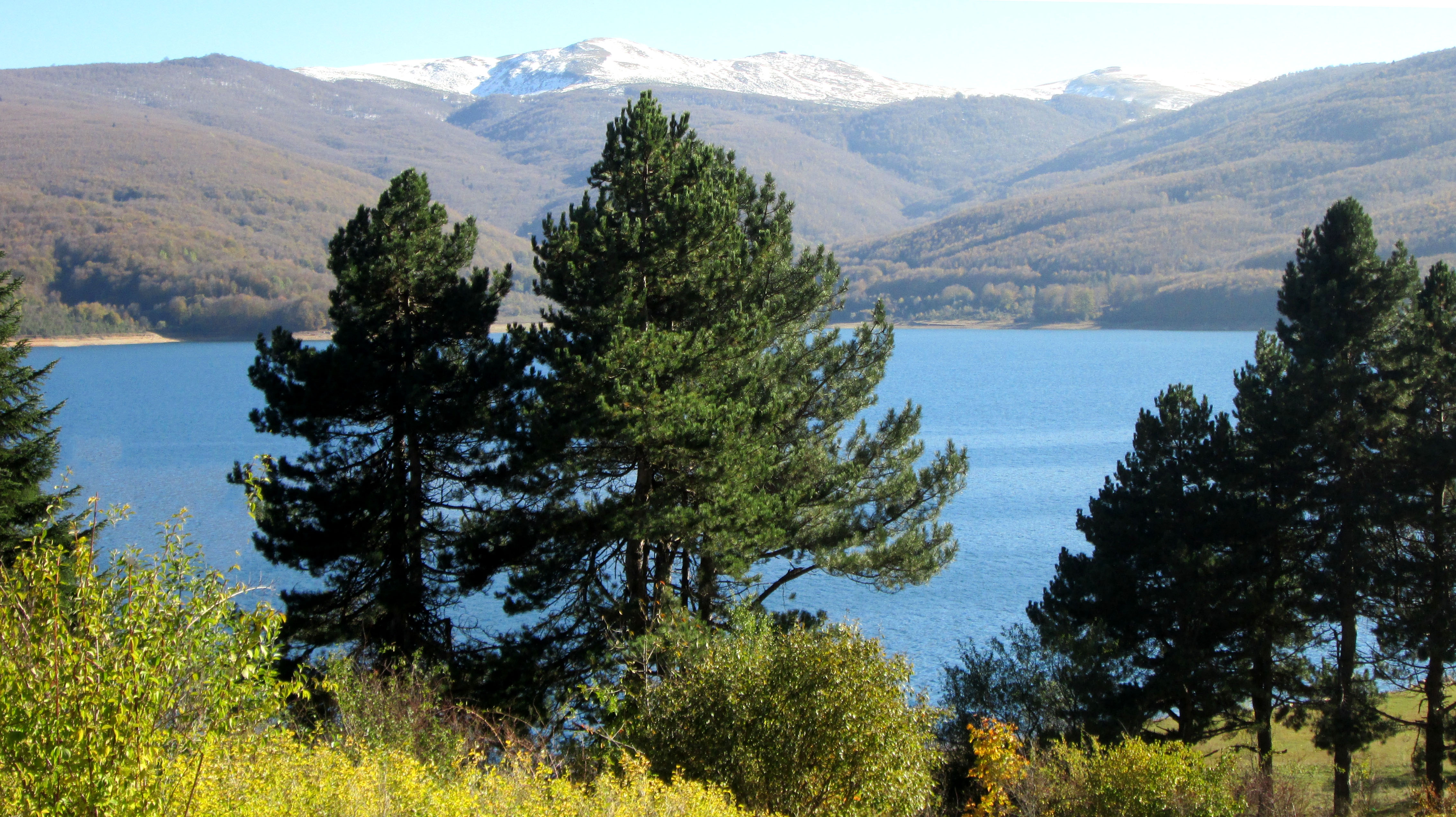 Outdoor Landscape featuring Sapphire Water and Snow Capped Peaks
