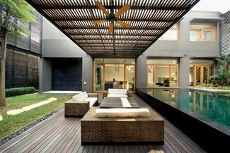 Outdoor Lounge Set with Slatted Wood Ceiling and Pool