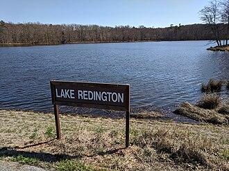 Outdoor Sign with White Block Typography for Lakefront Signage