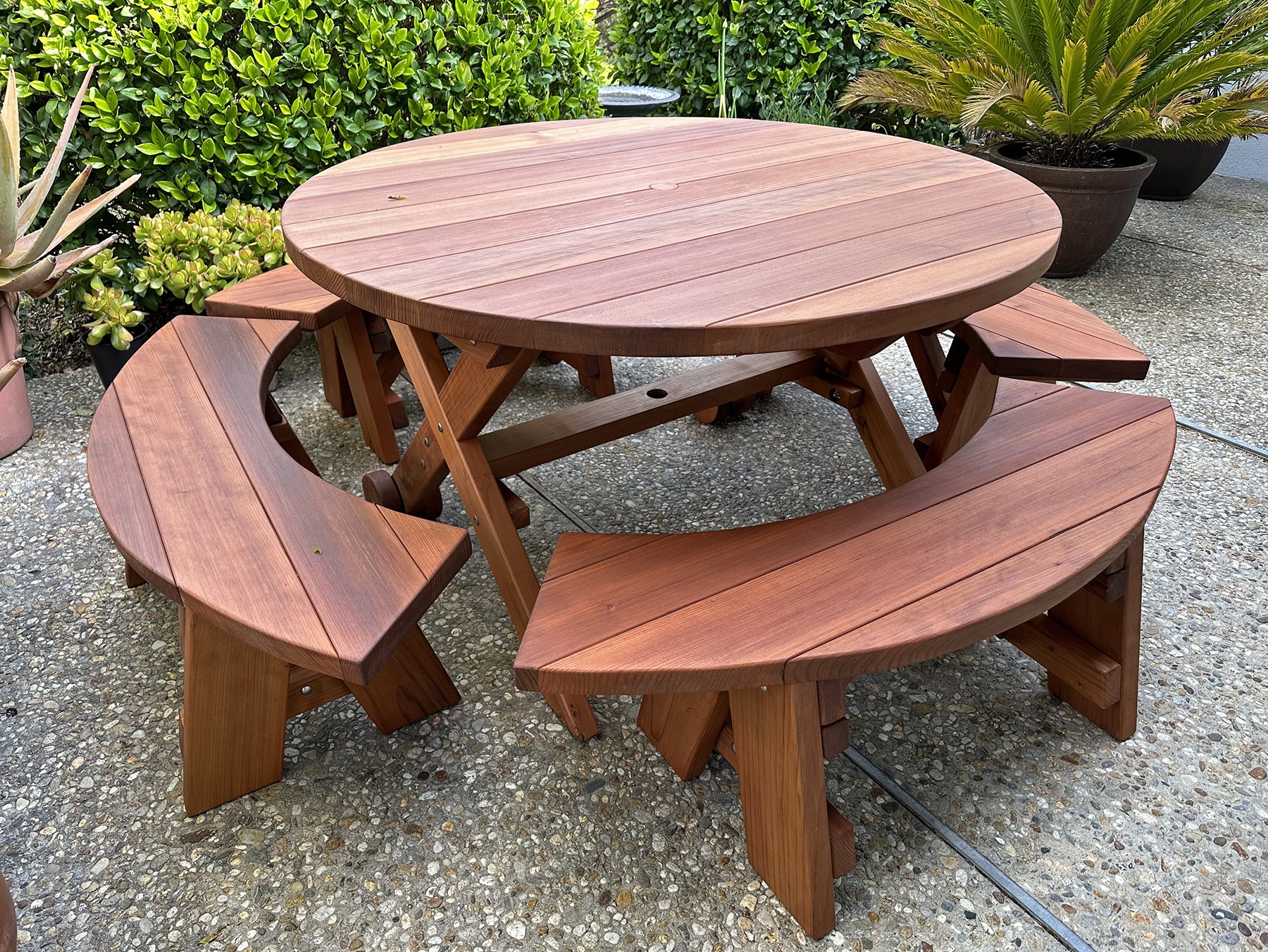 Picnic Table with Integrated Wheels and Curved Benches