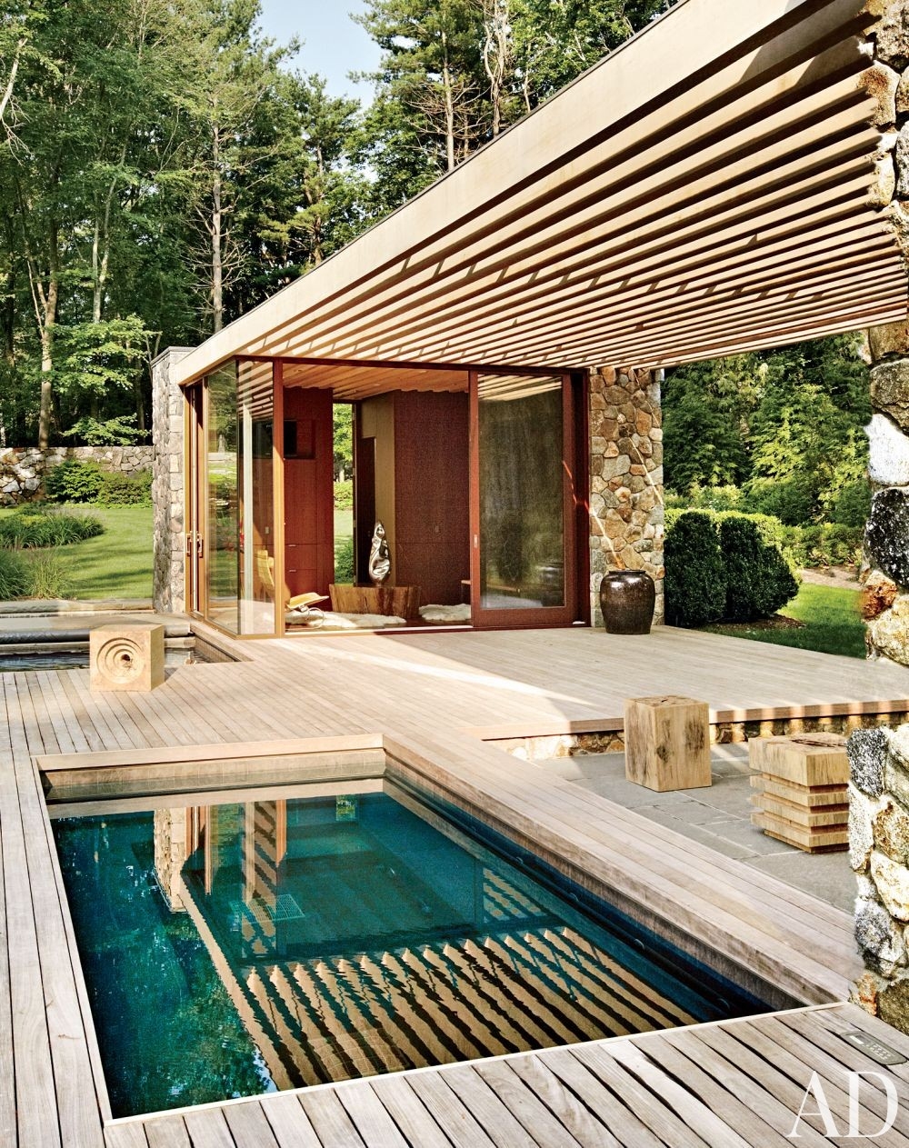 Pool Pavilion with Slatted Wood Canopy and Stone Walls