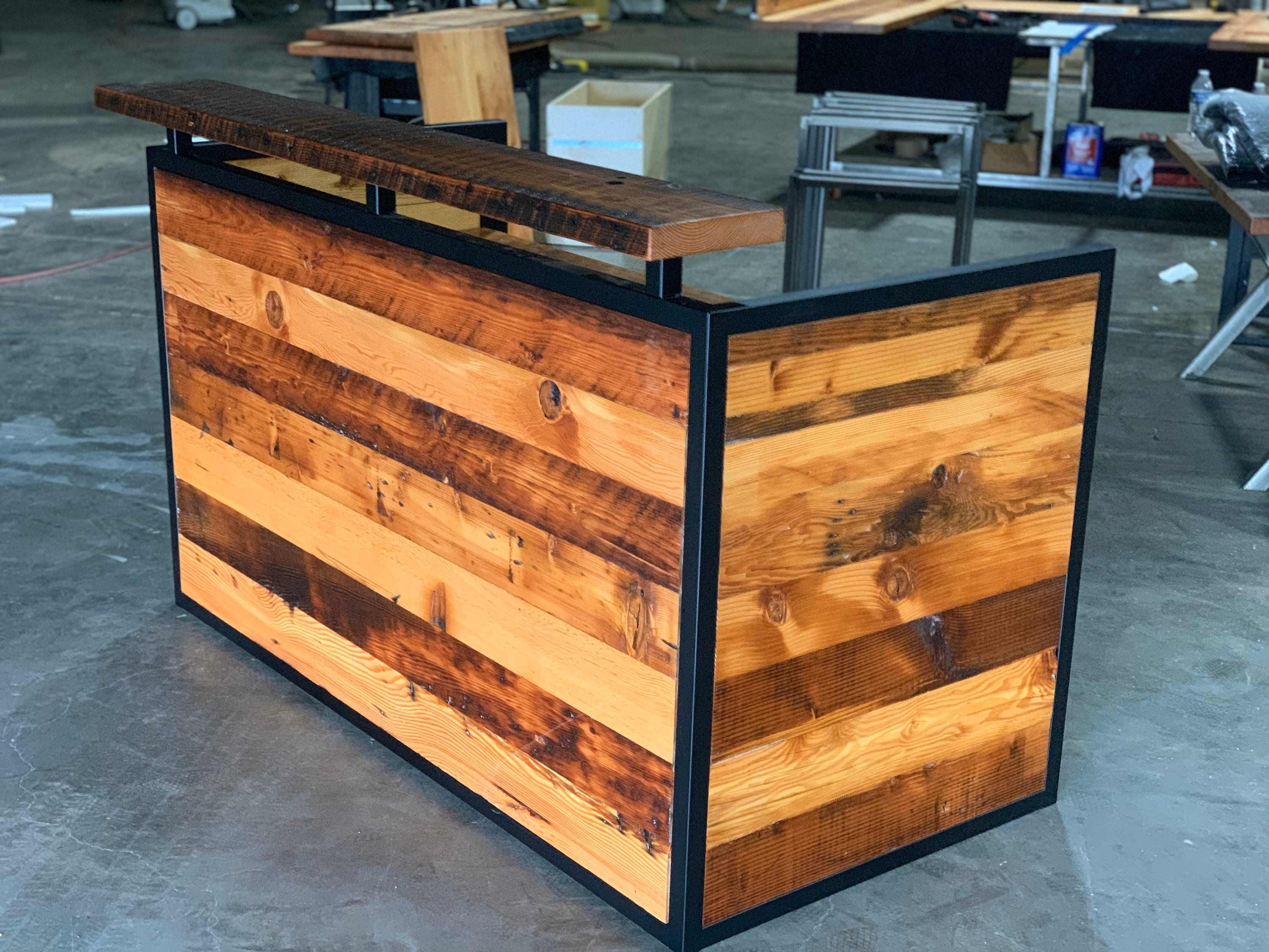 Reception Desk Featuring Matte Black Frame and Industrial Wood