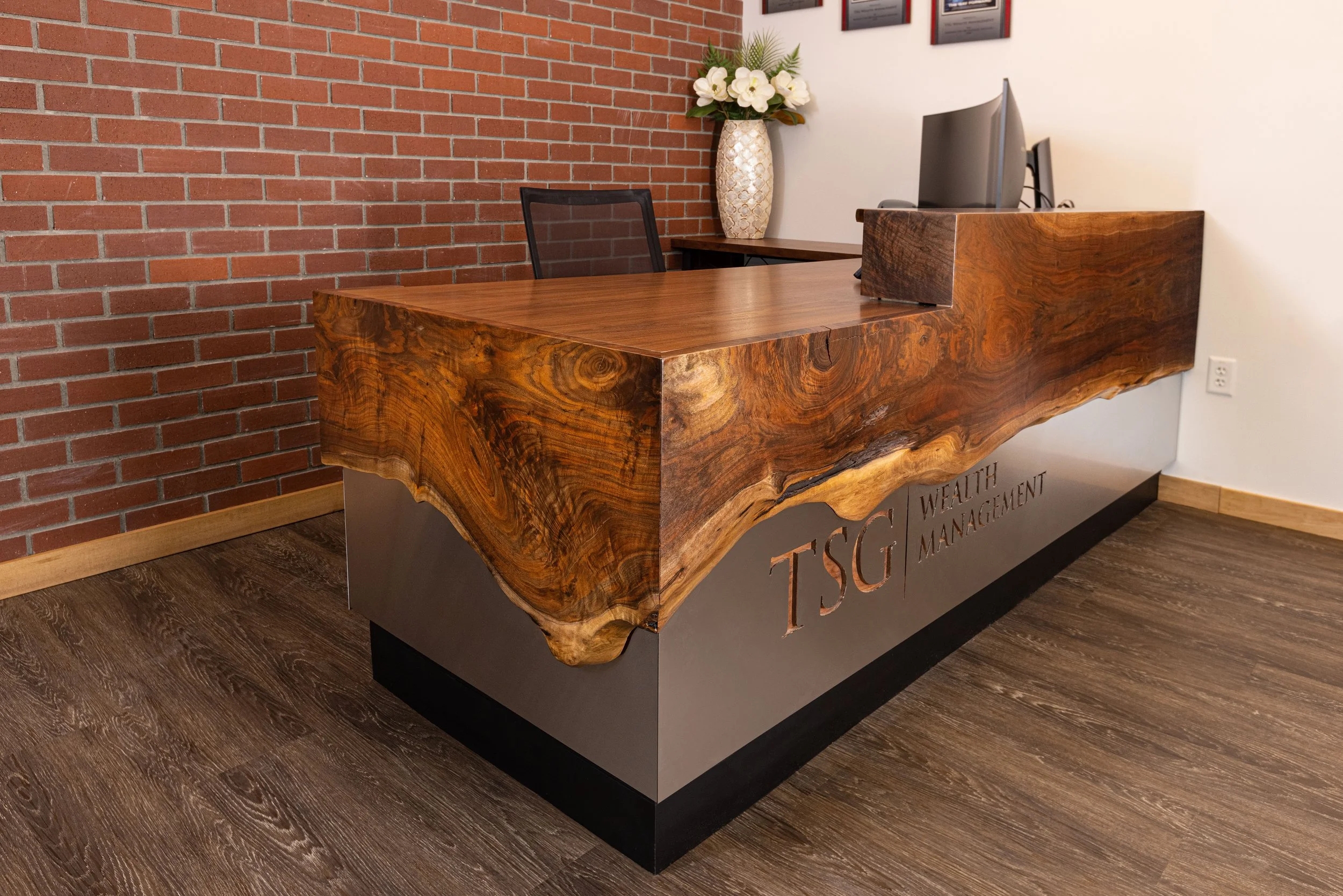 Reception Desk with Engraved Metal Base and Custom Wood