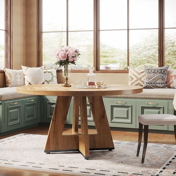 Round Dining Table: Architectural Pedestal Base and Splayed Legs