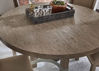 Round Dining Table with Curved Metal Stretcher and Weathered Top
