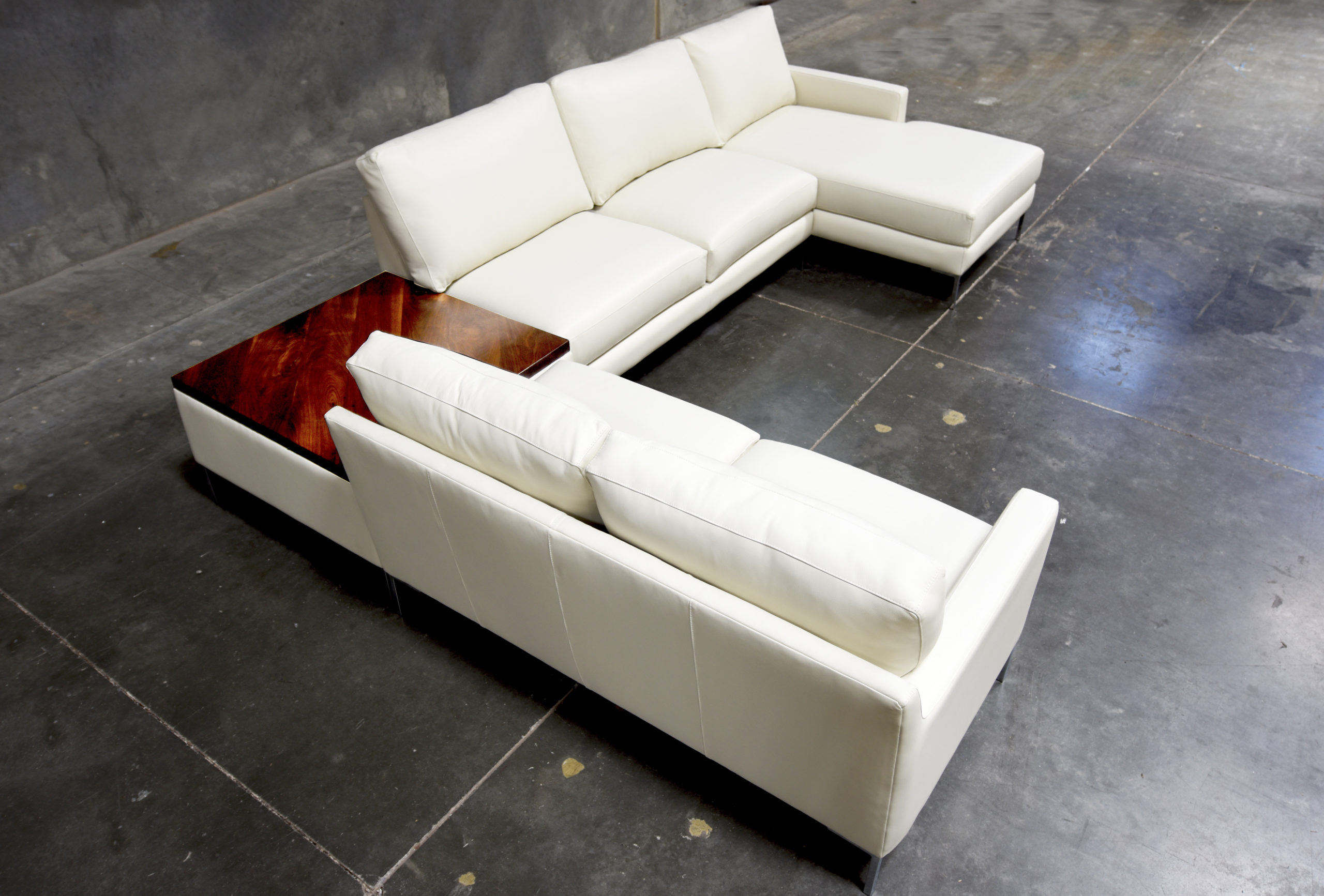 Sectional Sofa with Integrated Walnut Table and Cream Upholstery