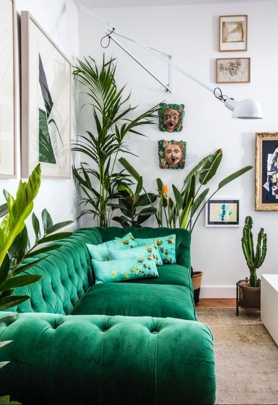 Sectional Sofa with Oversized Swing Lamp and Greenery