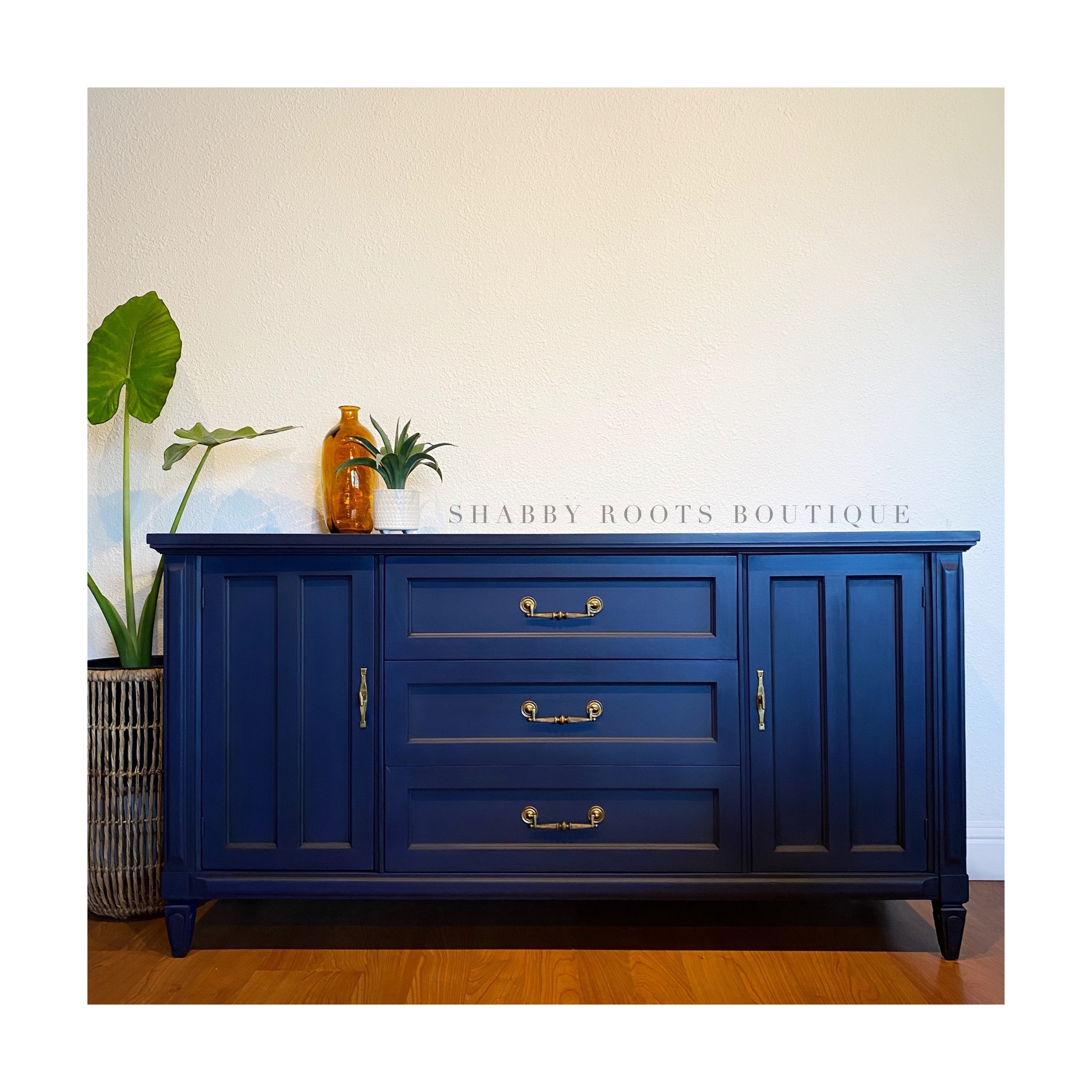 Sideboard with Ornate Brass Pulls and Vertical Paneling