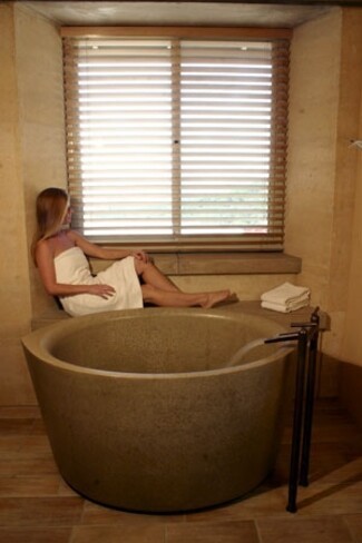 Soaking Tub as Round Concrete Soaking Tub with Stone Ledge