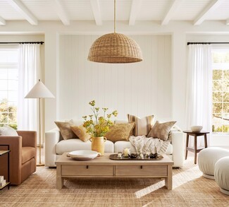 Sofa Styled With Fluted Ottomans Rattan Dome Pendant Light
