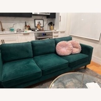 Sofa with Round Pleated Pillows and Tapered Wood Legs