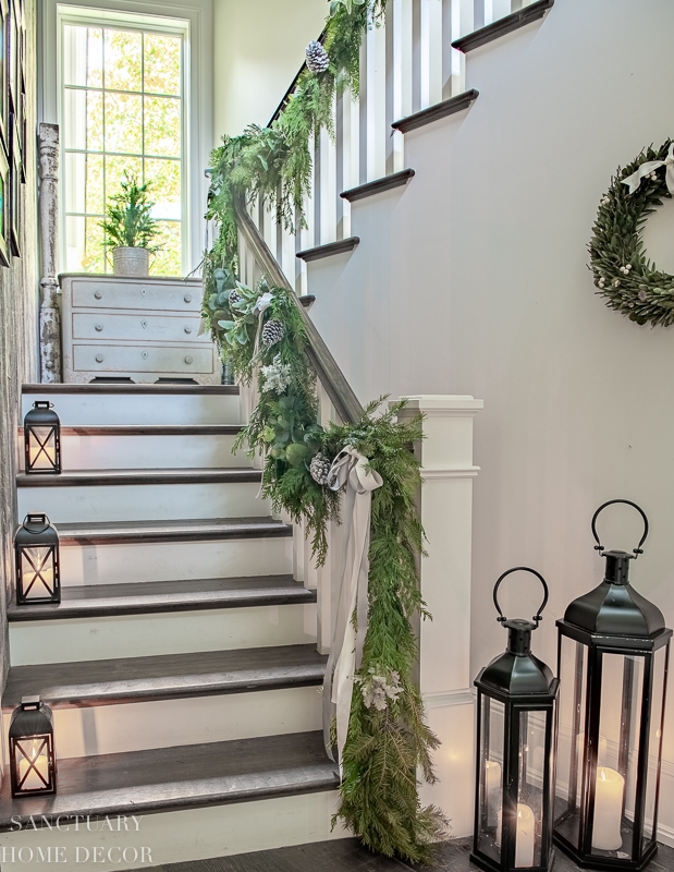Staircase Decor with Oversized Floor Lanterns and Cedar Swag