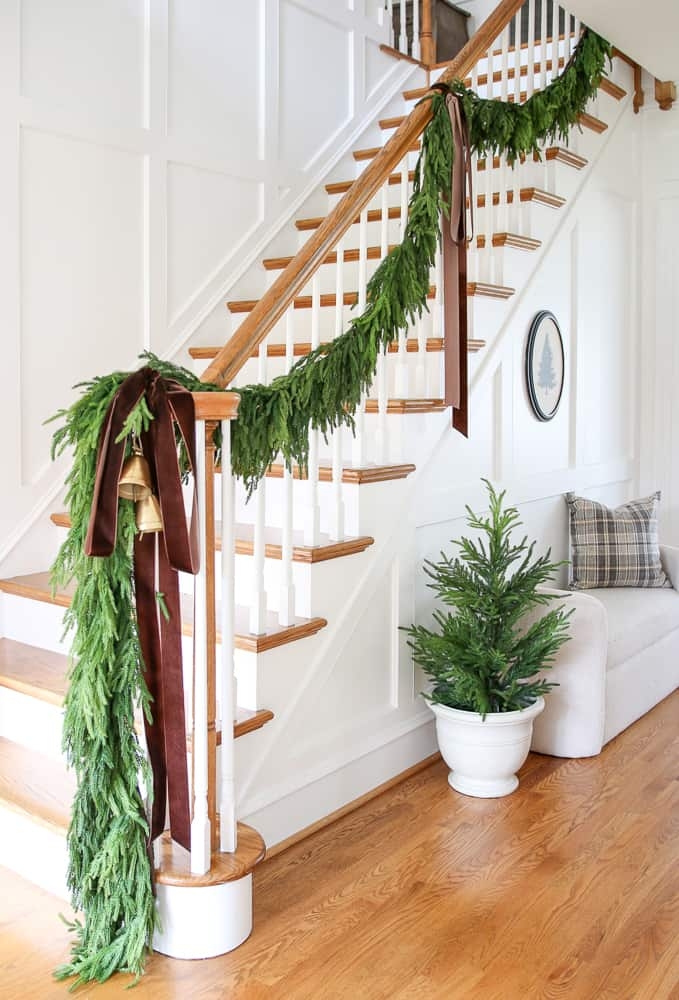 Staircase Garland Featuring Long Velvet Ribbons and Gold Bells