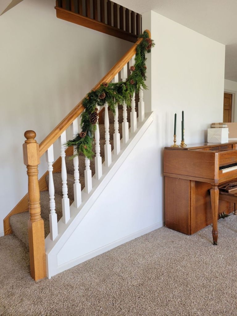 Staircase Garland with Pinecone Accents and White Spindles