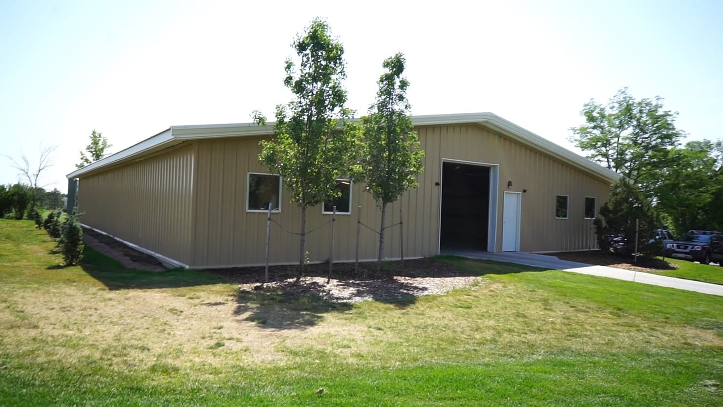 Storage Building: Tan Ribbed Siding Gabled Utility Design