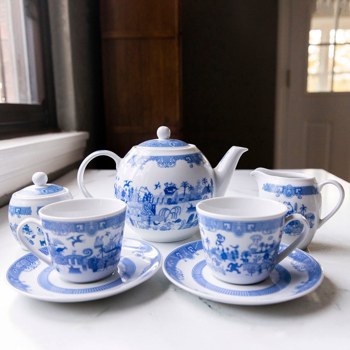 Tea Set with Whimsical Illustrations and Teapot Scenes