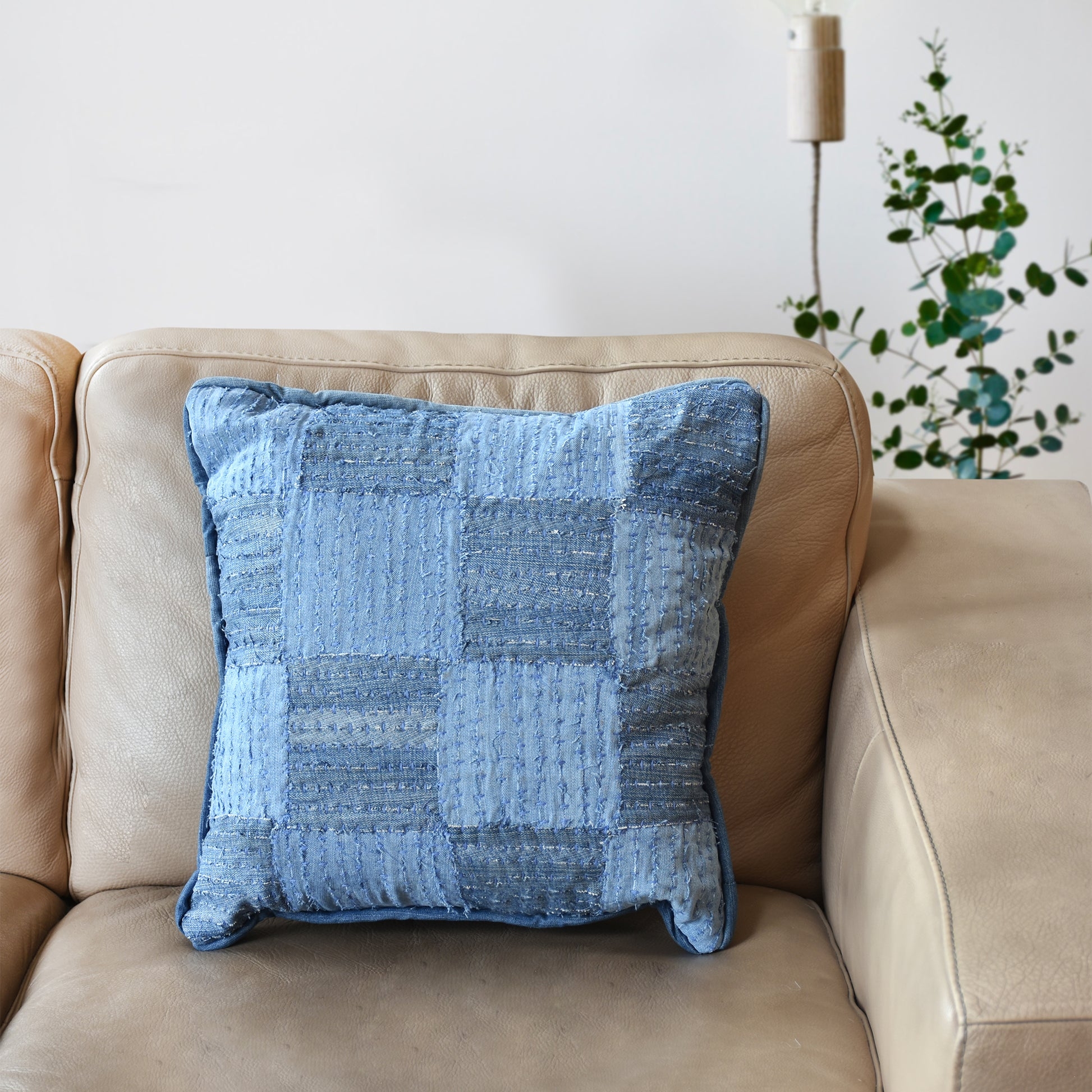 Throw Pillow with fringed seams blue denim patchwork pillow