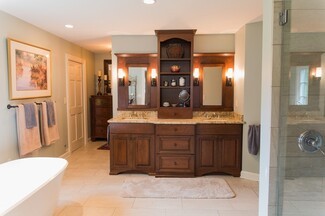 Traditional Double Vanity: Wood Toned Storage Tower