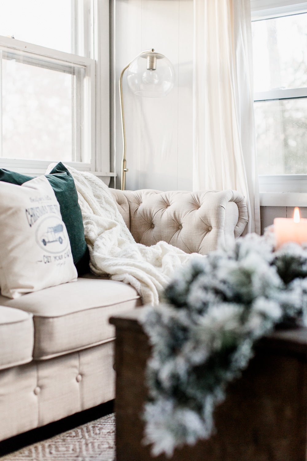 Tufted Sofa Featuring Diamond Tufting Brass Globe Floor Lamp