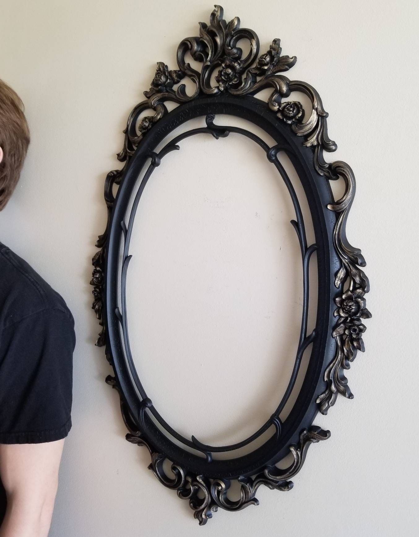 Wall Mirror in Rococo Black Oval Frame with Ornate Scrollwork
