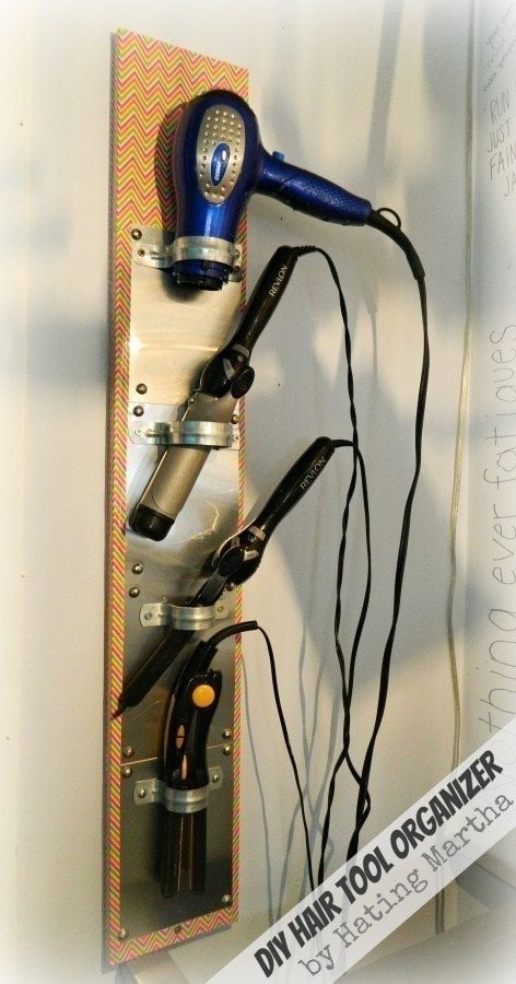 Wall Organizer: Silver metallic vertical vanity organizer with clamps
