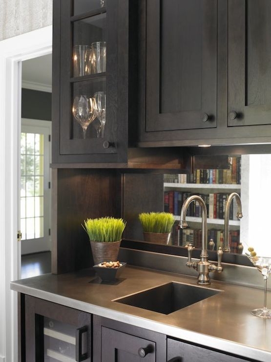 Wet Bar Sink With Mirrored Backsplash And Espresso Wood