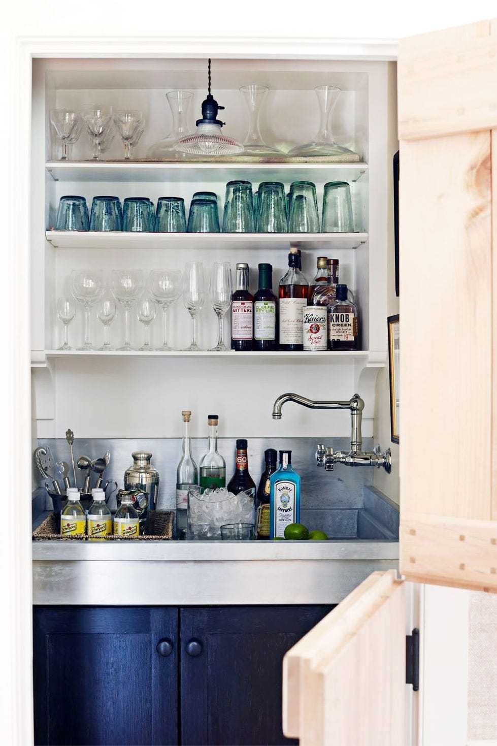 Wet Bar With Integrated Metal Sink In A Navy Blue Nook