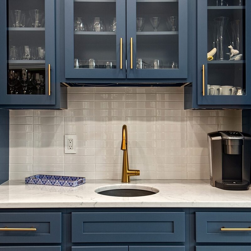 Wet Bar With Navy Blue Shaker And Glass Front Cabinets