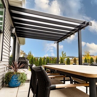 Attached Pergola Featuring Solid Roof Panels and Black Frame