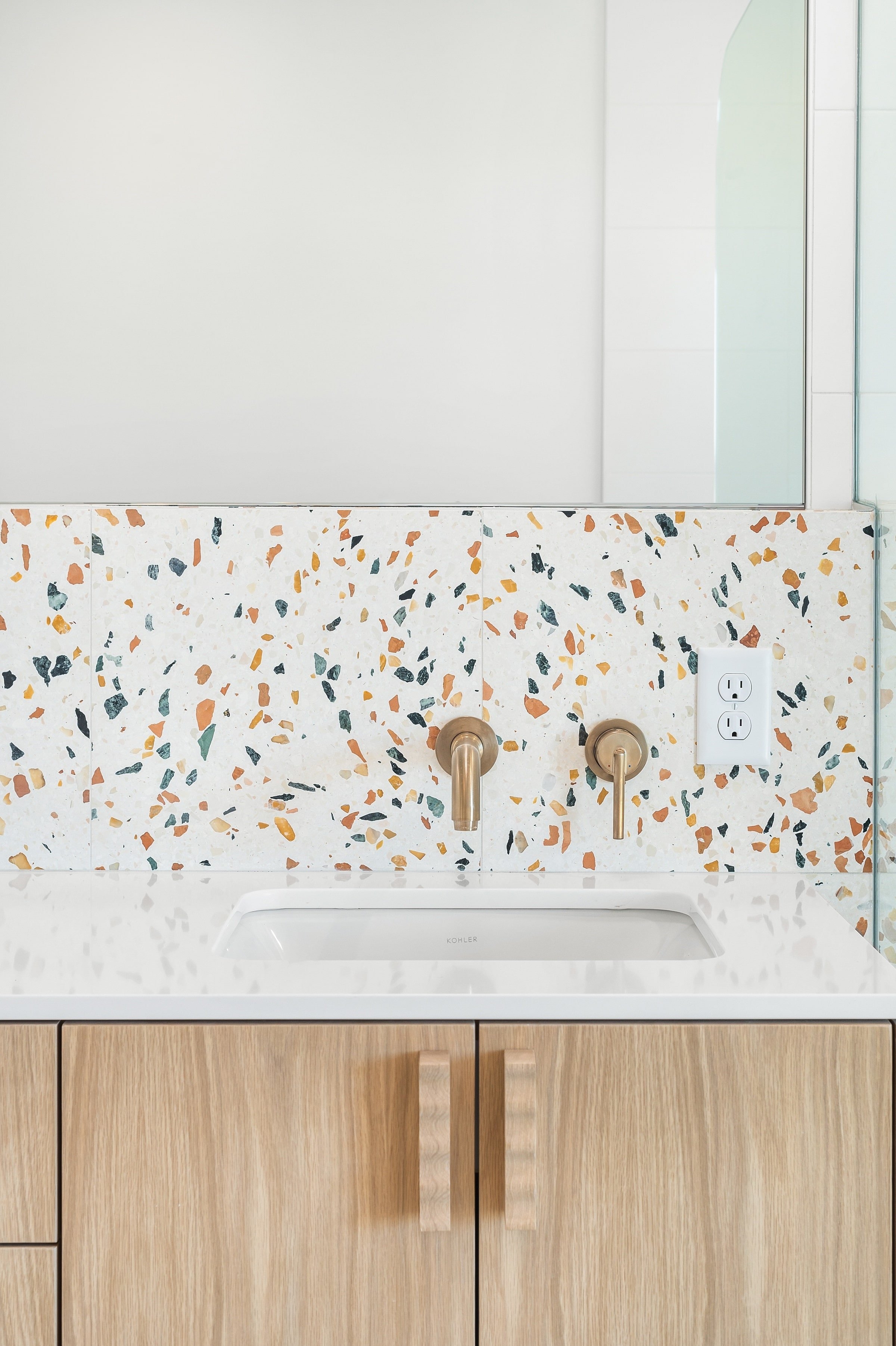 Bathroom Vanity: Wavy Wood Pulls and Terrazzo Backsplash