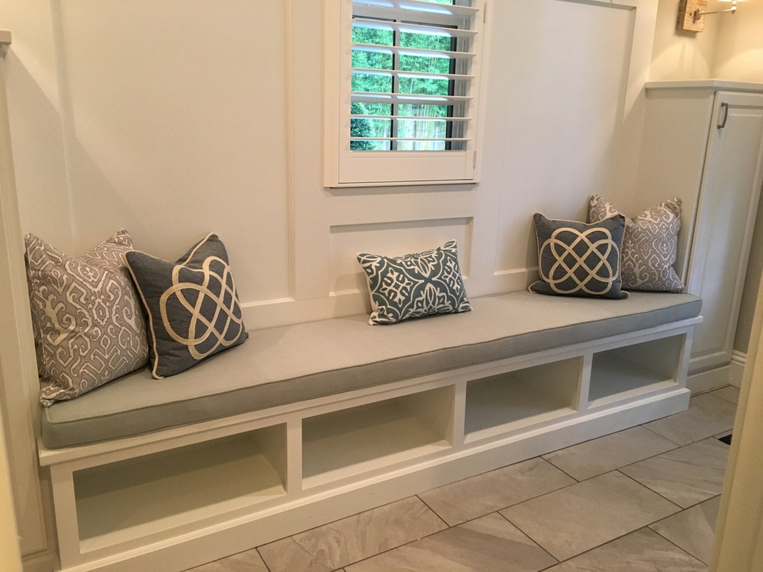 Built In Bench with Custom Piped Cushion and Open Cubbies
