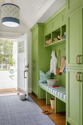 Built In Mudroom with Vibrant Green and Striped Cushions