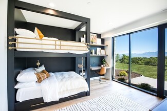 Bunk Bed: Matte Black Built-In Bed With Desk and Brass Rails