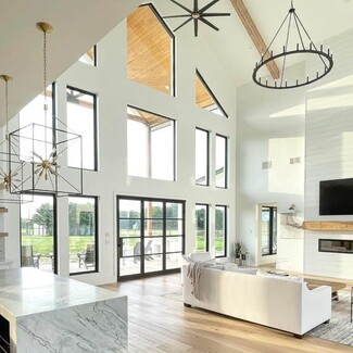 Chandelier: Wagon Wheel Frame Vaulted Ceiling Great Room