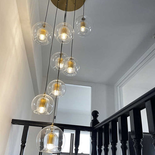 Chandelier: Warm Brass Staggered Glass Multi-pendant Globe