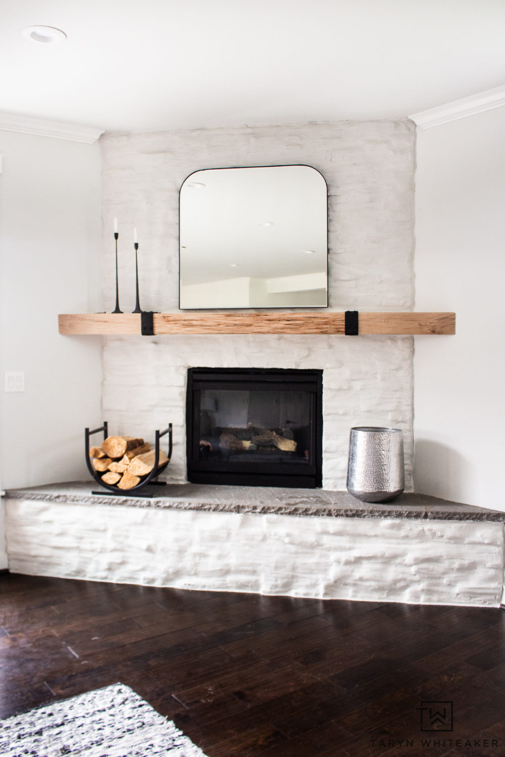 Corner Fireplace: Timber Mantel Whitewashed Masonry Arched Focal Look
