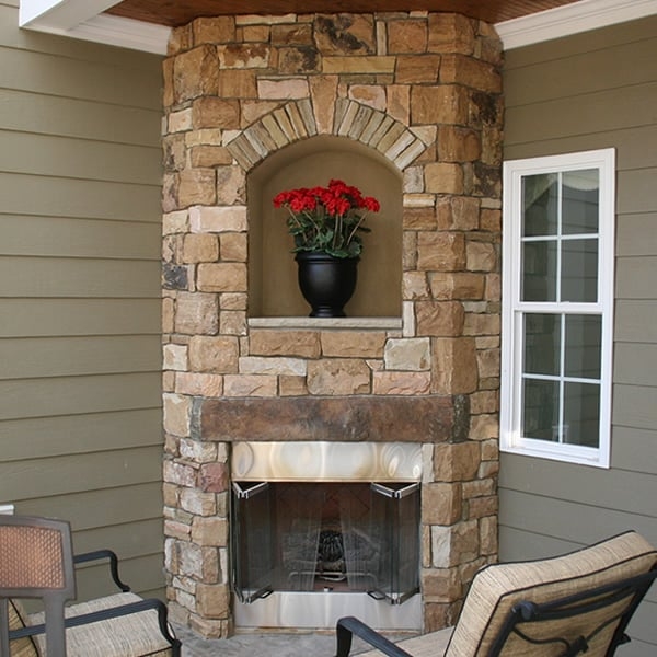 Corner Fireplace with Arched Display Niche and Stone Texture