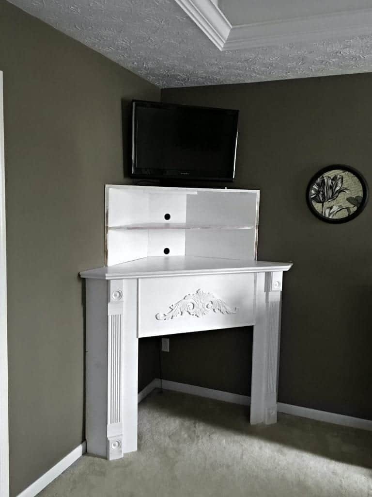 Corner Mantel TV Stand With Ornate Carving And Fluted Columns