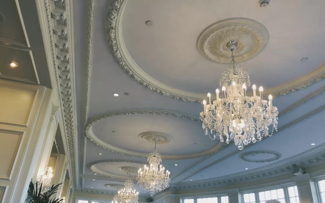 Crystal Chandelier: Tiered Design with Ornate Plaster Detail